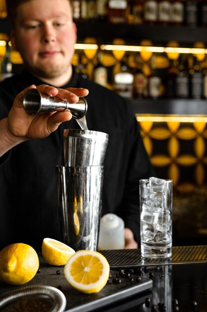 Summer menu of cocktails and lemonades Bartender prepaining coctails the process