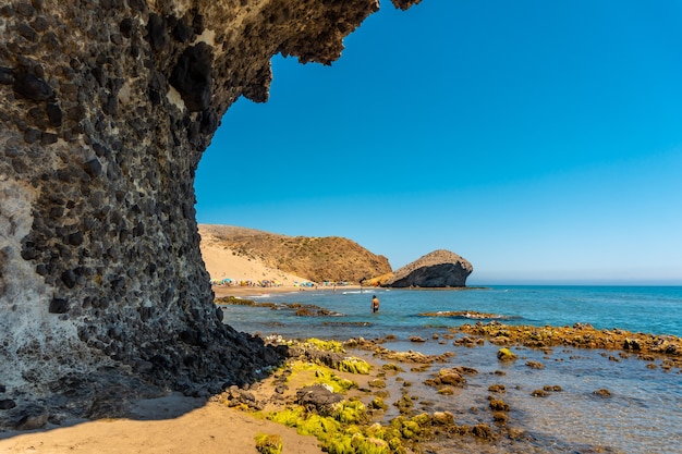 Summer at Monsul Beach in the Cabo de Gata Natural Park, created with eroded lava formations in the municipality of San Jose, Almeria