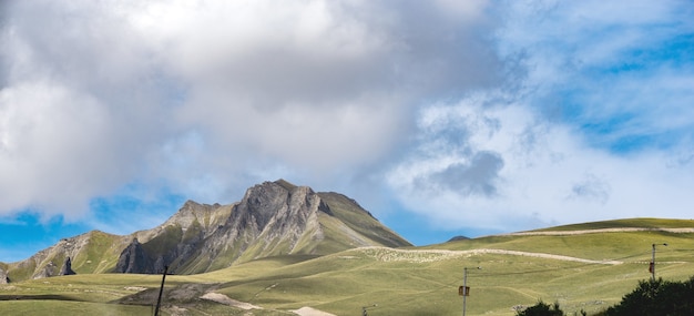 Summer mountains green grass and blue sky landscape