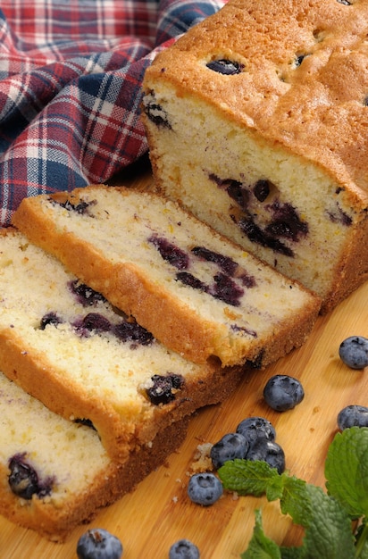 Summer pie  blueberry with sliced berries on a blackboard