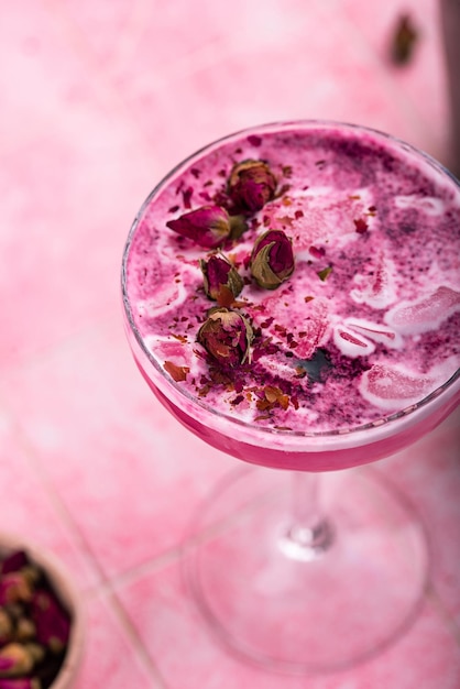 Summer pink cocktail with rose flowers