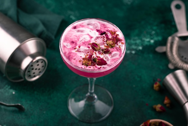 Summer pink cocktail with rose flowers