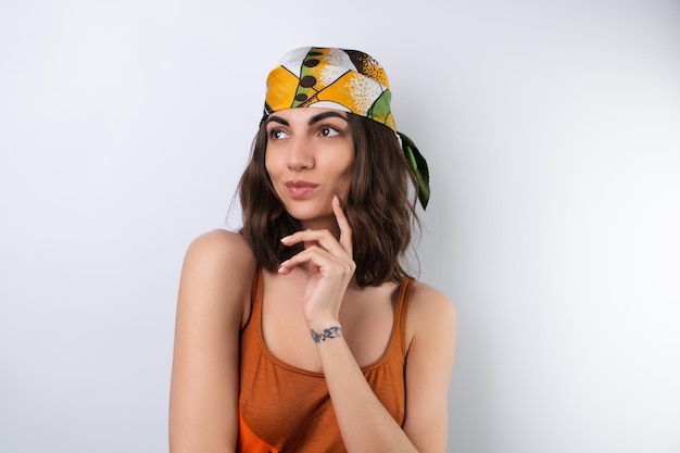 Summer portrait of a young woman in a sports swimsuit headscarf