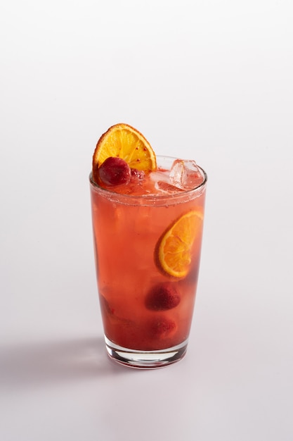 Summer refreshing cocktail with ice. Lime soda, blueberry puree, lemon juice, strawberry puree.