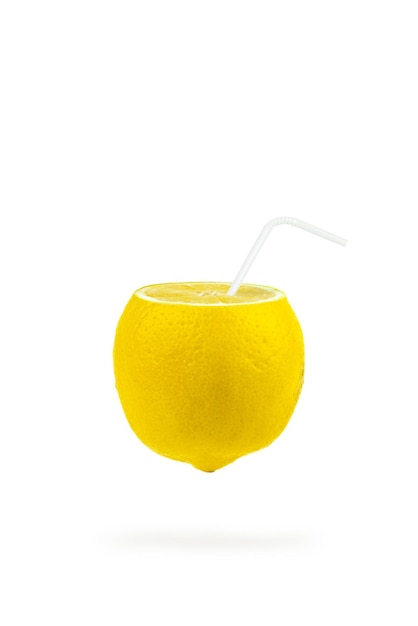 Summer refreshing drink. Levitation of lemon slices with a straw on white background. Levitation of freshly cut lemon, vertical, closeup.