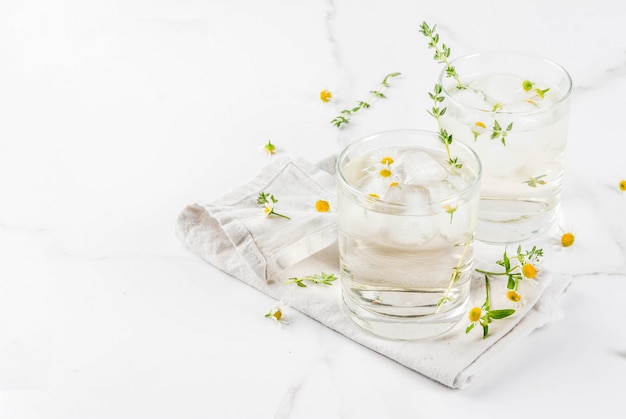 Summer refreshing drinks, infused herbal water, iced tea. Chamomile Honey and Whiskey Cocktail