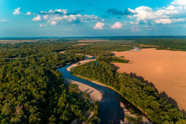 夏の田園風景空撮ドローン飛行からの森と川