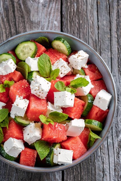 Summer salad with watermelon mint cucumber and feta cheese close up