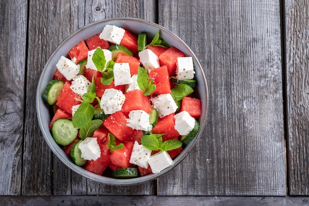 Summer salad with watermelon mint cucumber and feta cheese close up