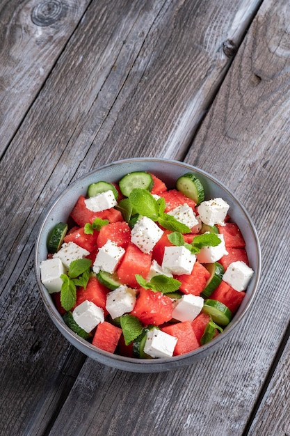 Summer salad with watermelon mint cucumber and feta cheese close up