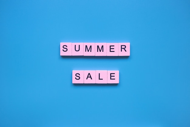 Summer sale words on a blue background Sesonal sale shopping concept