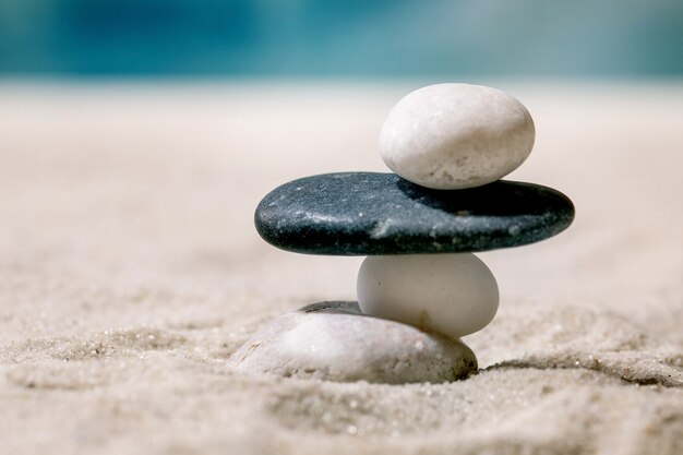 Summer sand sea beach with waves and stones