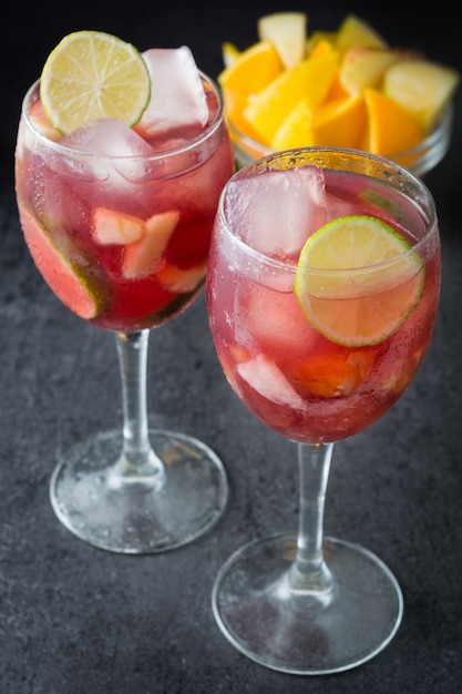 Summer sangria in glass on black