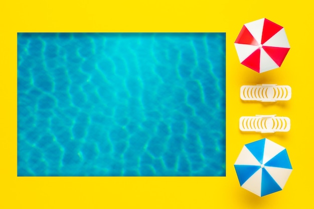 Summer scene with swimming pool sun umbrella and sunbed