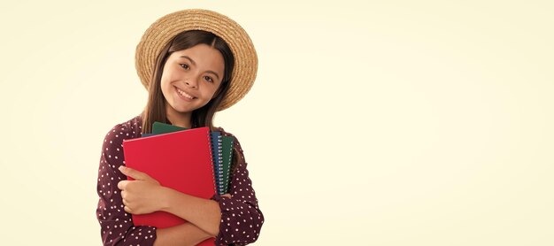 Summer school happy cute teen girl in straw hat hold school workbook for studying isolated on white