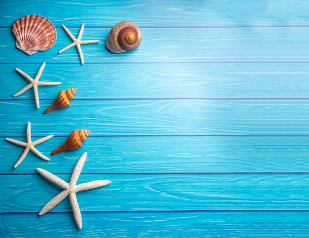 Summer sea holiday background shells star on a wooden blue background