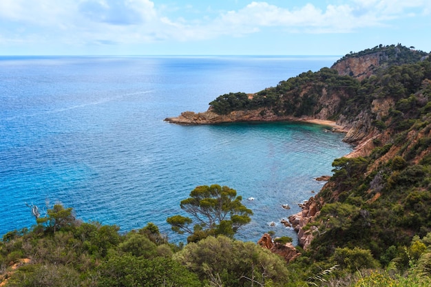 Summer sea rocky coast view with small sandy beach Costa Brava Catalonia Spain