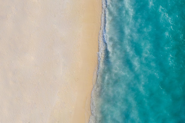 Summer seascape beautiful waves, blue sea water Mediterranean relax sunny shore. Top view from drone