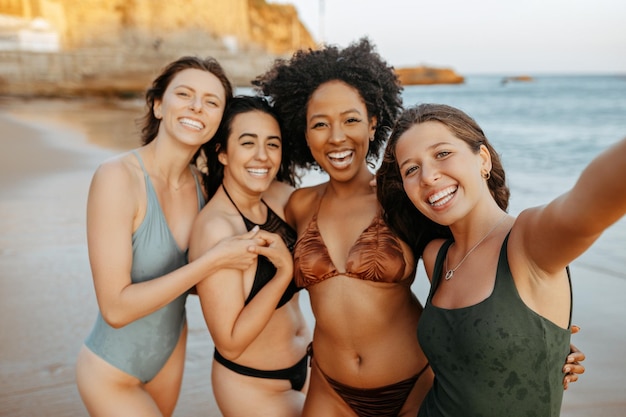Summer selfie beach and diverse women friends enjoying holiday and weekend together taking photo for