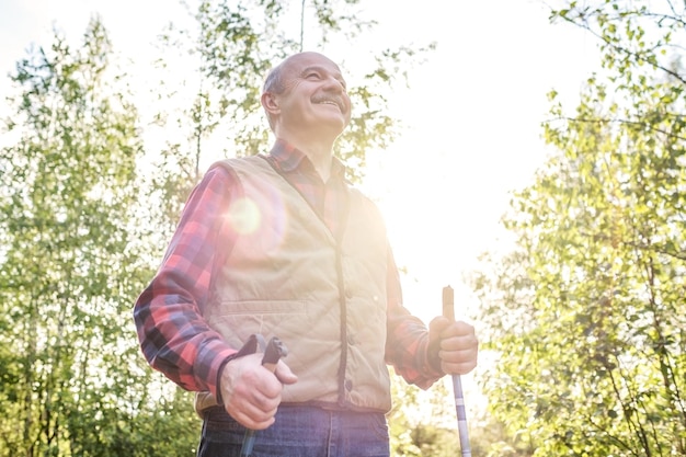 Summer sport for senior people Nordic walking