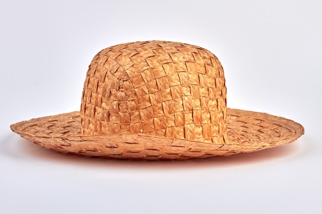 Summer straw hat isolated on white. Vintage fashion concept.