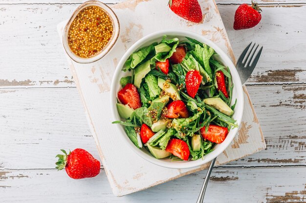 Summer strawberry salad with avocado lettuce with honey mustard sauce