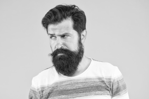 Summer style Man bearded stylish beard yellow background Barber tips Stylish beard and mustache Hipster style Beard fashion Barber services Hairdresser salon Fancy mustache Male portrait