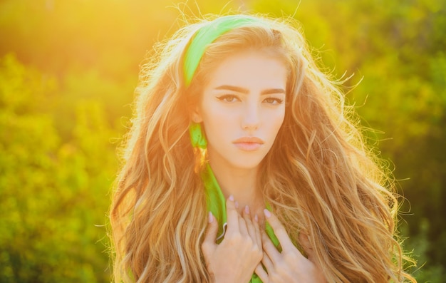 Summer sunlight portrait Spring girl outdoor in green coat Seasonal fashion