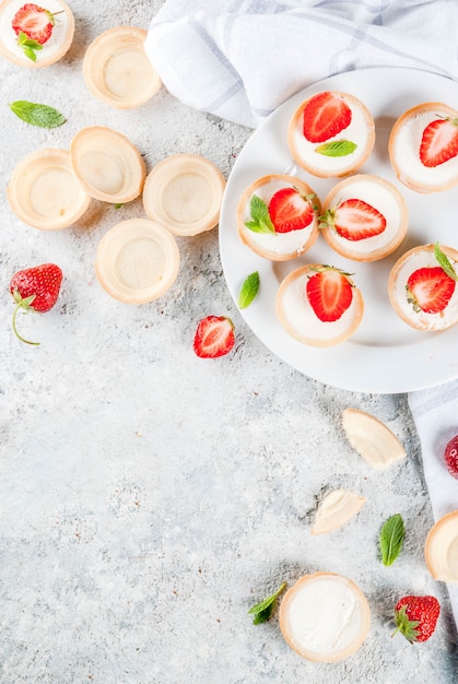 Summer sweet homemade dessert, Mini cheesecakes with strawberry