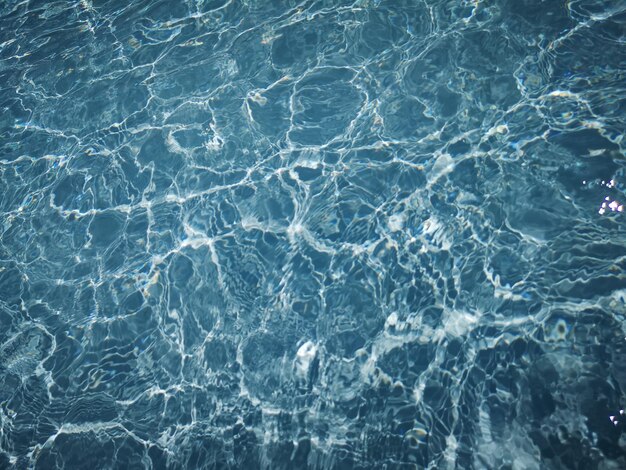 Summer swimming pool sea level water surface wave texture background