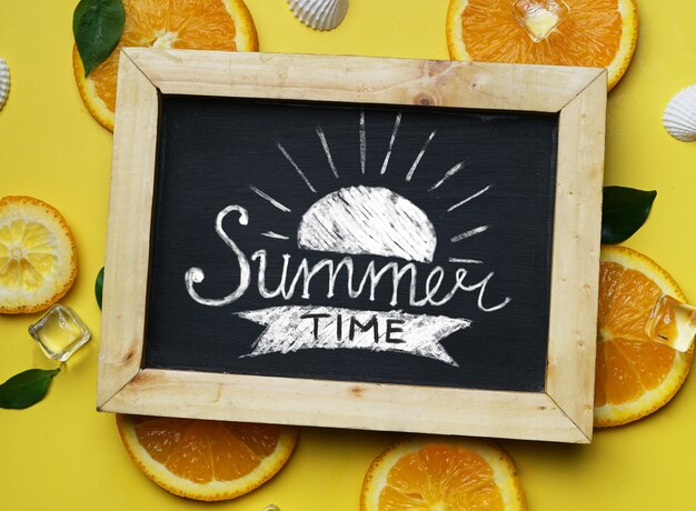 summer time typography on blackboard on yellow background