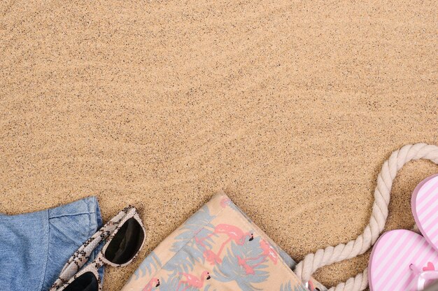 Summer vacation concept, beach accessories on the sand