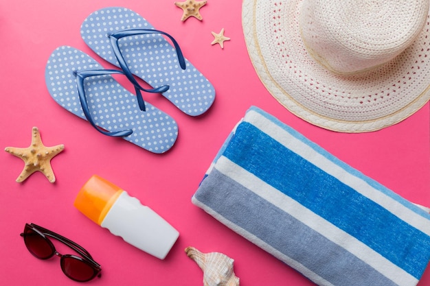 Summer vacation concept flat lay beach accessories and towel top view Space for text travel concept