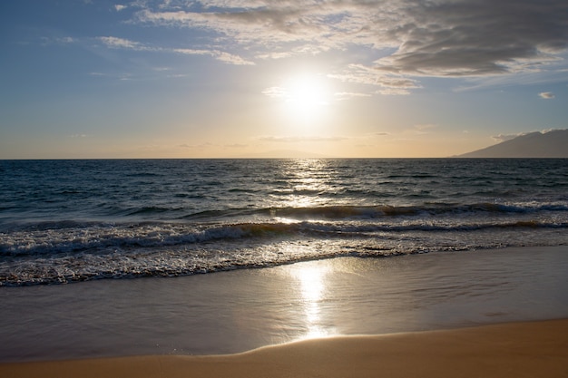 Summer vacation, holiday sunset background of a tropical beach and blue sea. Hawaii beach.