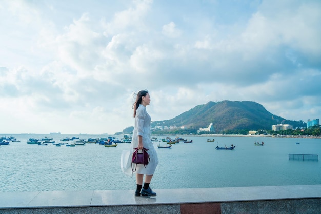 Summer Vacation Smiling Asian women relaxing and standing walking on the beach Vung Tau so happy