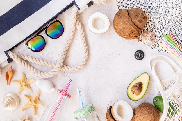 Summer vibes flat lay Beach hat sunglasses and fruit top view with copy space