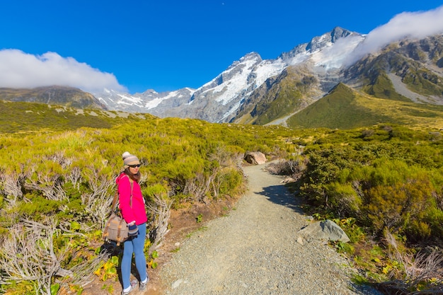 Summertime , Asian woman enjoy travel at mount cook national park in south Island New Zealand