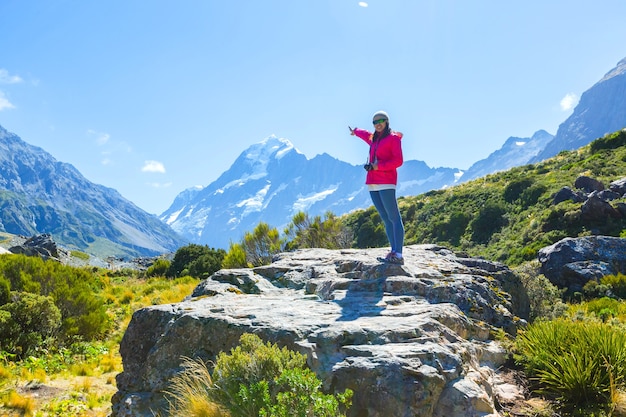 Summertime , Asian woman enjoy travel at mount cook national park in south Island New Zealand