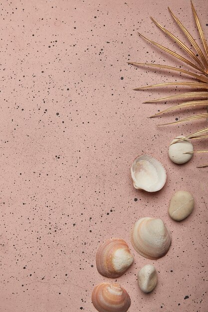 Summertime elegance on pink sand featuring golden accents and copy space