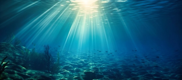 Sun beams coming through an underwater blue sea