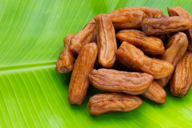 Sun-dried bananas on banana leaf