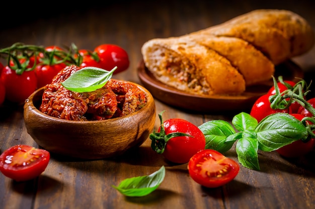 Sun dried and pickled tomatoes with fresh herbs and spices