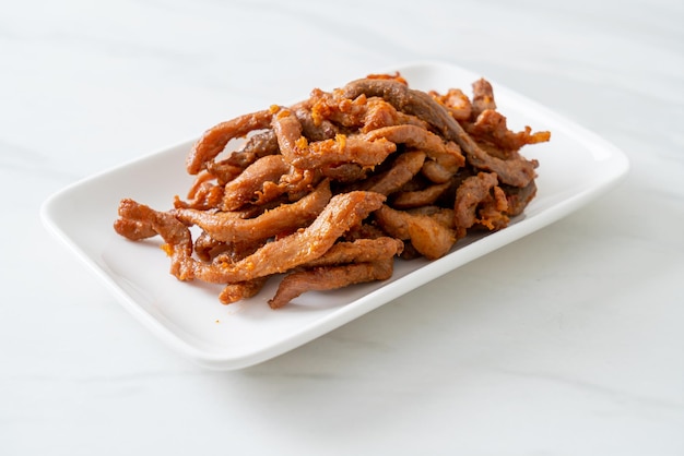 Sun-Dried Pork on white plate - Asian food style