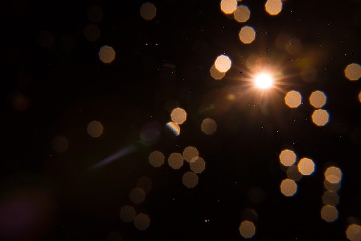 Photo sun flare on black object design.
