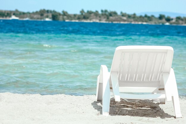 A sun loungers by the sea in nature weekend travel