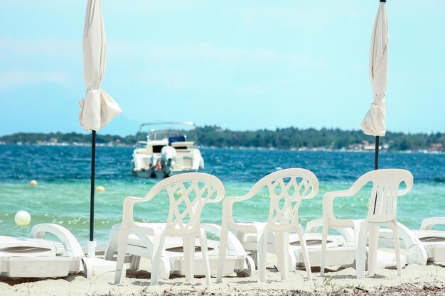 A sun loungers by the sea in nature weekend travel