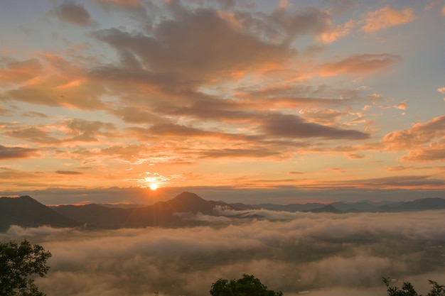 sun rise over mountain with fog in the morning