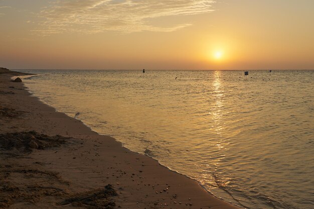 The sun rises over the Red Sea at dawn