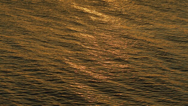 Sun and sea glittering of day sunlight reflects on sea surface water surface at deep ocean real time