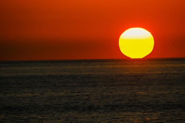 Sun setting on the atlantic ocean in tenerife canary island spain